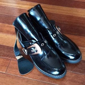 Black moto booties with gold hardware